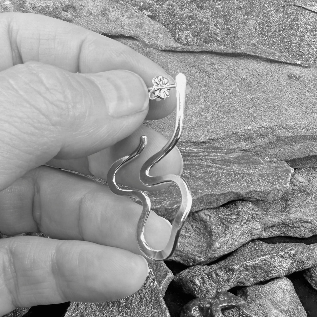 Hand-Forged Abstract Sculptural Hoop Studs Scale in hand for scale