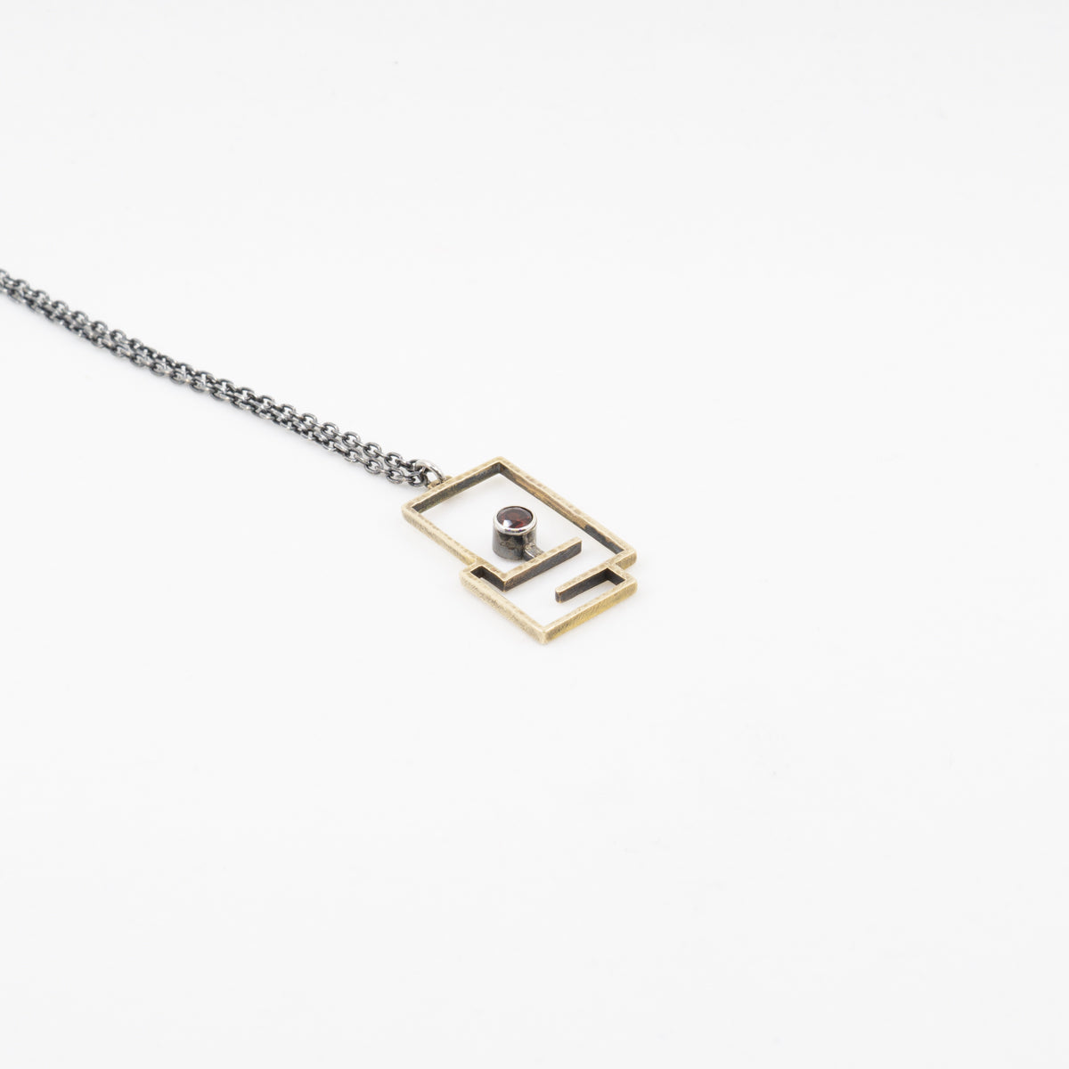 Path Pendant: Brass and Garnet