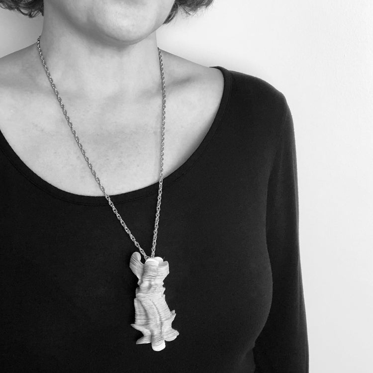 Black and  White Image of Necklace on Model for Scale